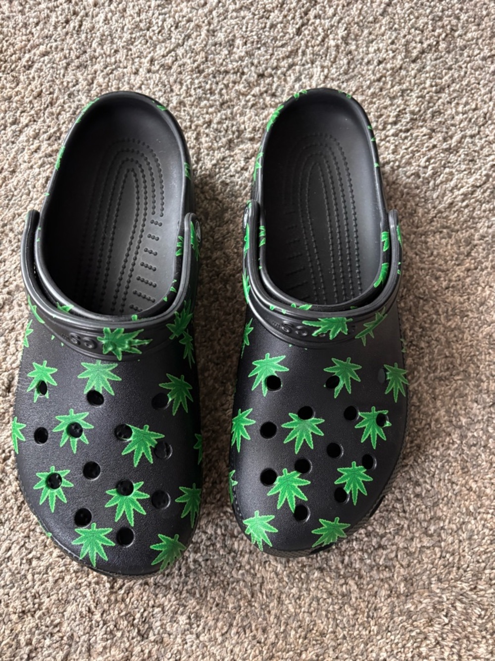 CROCS Black Slip-On Clogs with Green Leaf Print